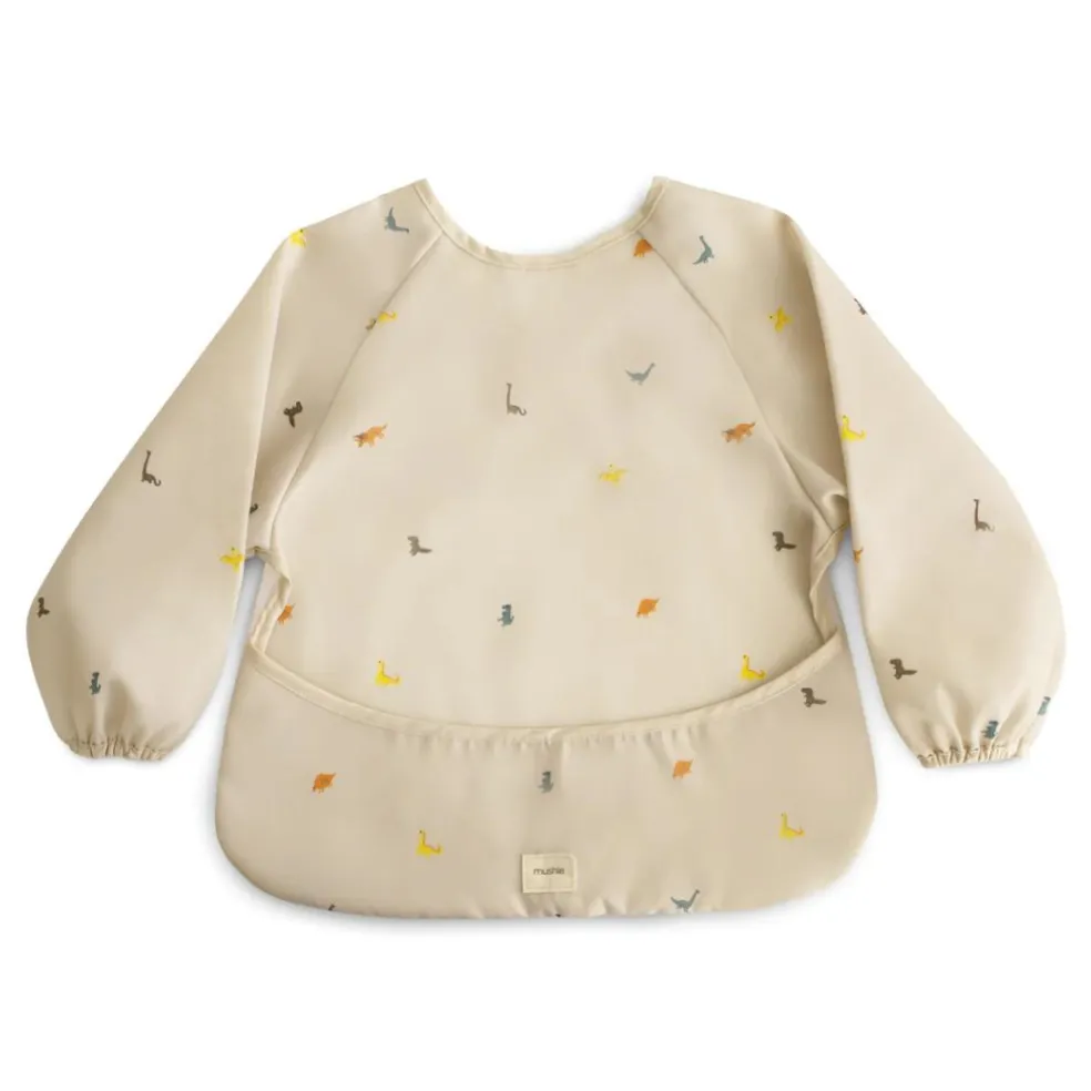 bavoir__manches_dinosaure_0.webp Bavoir à Manches Dinosaures - Mushie